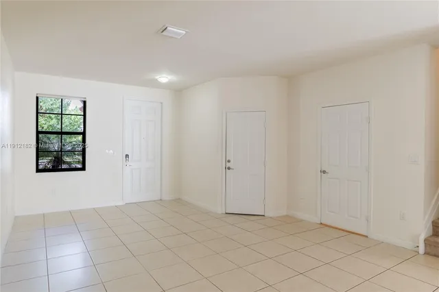 a view of an empty room and window