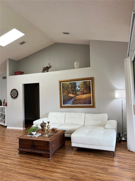 18266 Covina Way, Unit 202 Boca Raton, FL 33498 - Photo 12 of 52 a living room with furniture and wooden floor