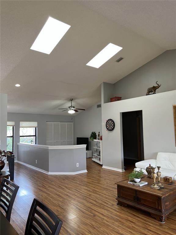 18266 Covina Way, Unit 202 Boca Raton, FL 33498 - Photo 23 of 52 a living room with furniture and wooden floor