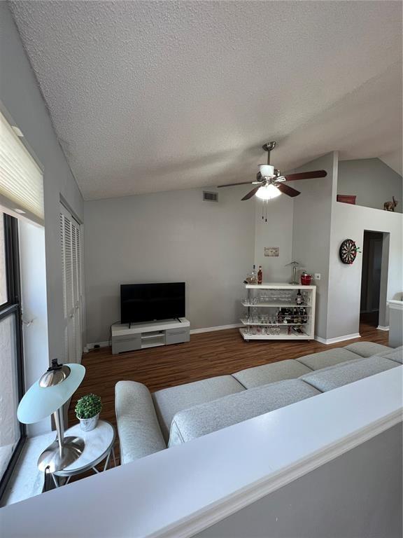 18266 Covina Way, Unit 202 Boca Raton, FL 33498 - Photo 24 of 52 a living room with furniture and a flat screen tv