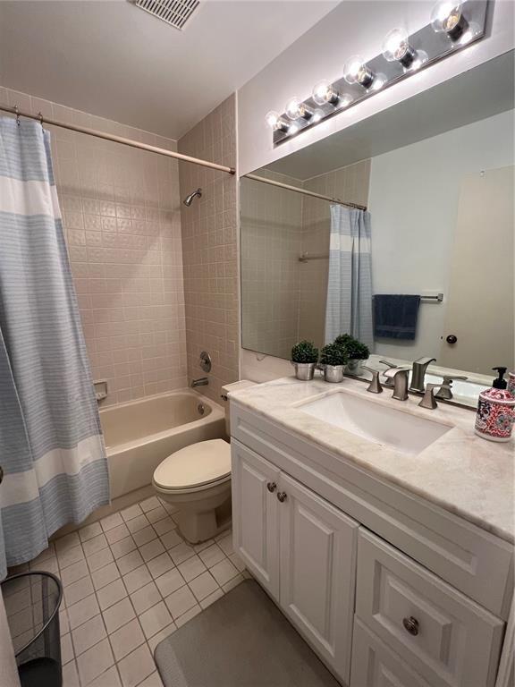 18266 Covina Way, Unit 202 Boca Raton, FL 33498 - Photo 38 of 52 a bathroom with a double vanity sink toilet mirror and bathtub
