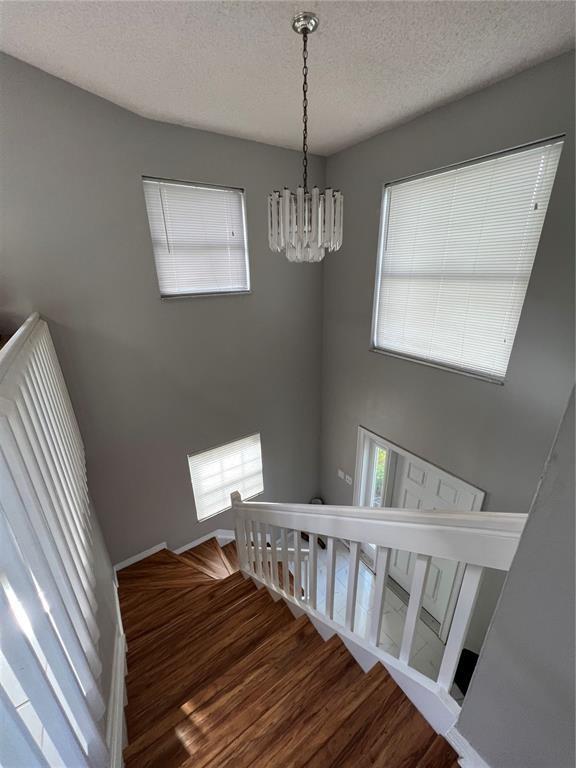 18266 Covina Way, Unit 202 Boca Raton, FL 33498 - Photo 39 of 52 a view of entryway and hall with wooden floor