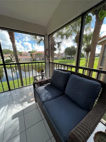 a living room with large windows