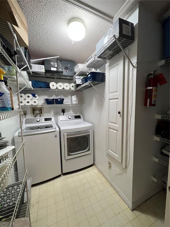 18266 Covina Way, Unit 202 Boca Raton, FL 33498 - Photo 41 of 52 a utility room with dryer and washer