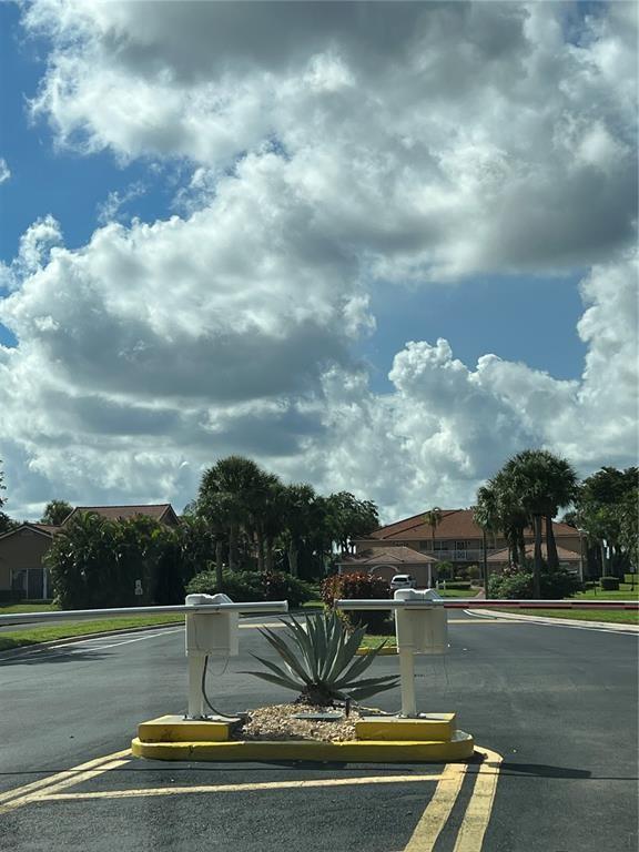 18266 Covina Way, Unit 202 Boca Raton, FL 33498 - Photo 45 of 52 a view of a fountain in front of a house