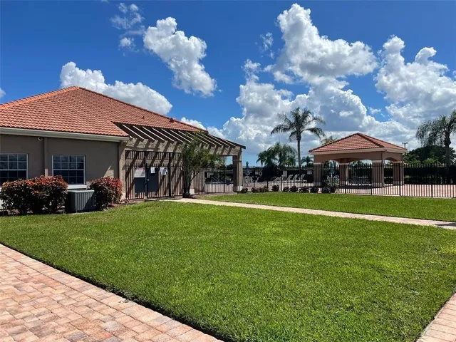 a view of a swimming pool with a patio