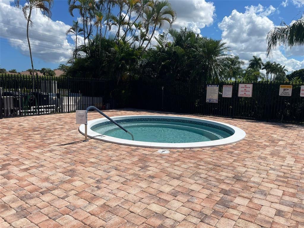 18266 Covina Way, Unit 202 Boca Raton, FL 33498 - Photo 49 of 52 a view of outdoor space yard swimming pool