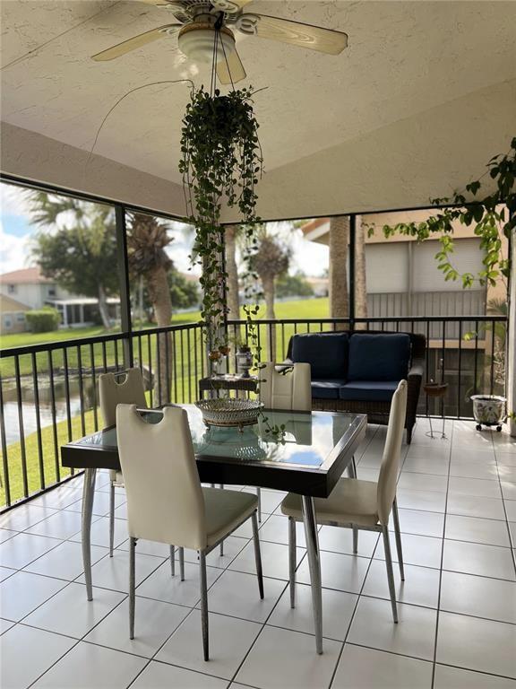 18266 Covina Way, Unit 202 Boca Raton, FL 33498 - Photo 7 of 52 a view of a dining room with furniture window and outside view