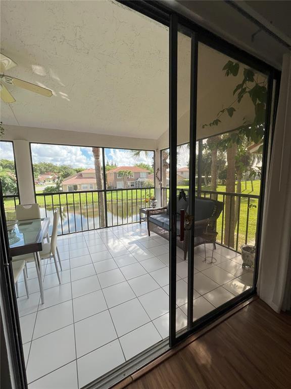 18266 Covina Way, Unit 202 Boca Raton, FL 33498 - Photo 8 of 52 a view of a living room and balcony