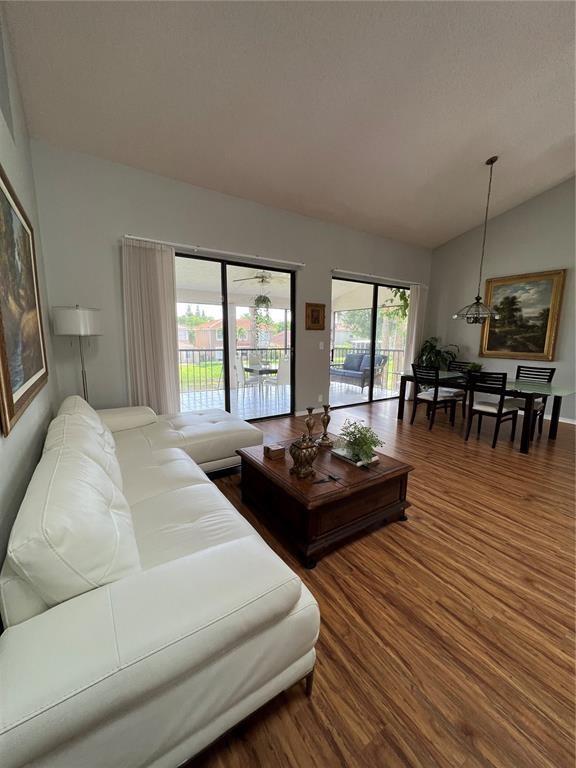18266 Covina Way, Unit 202 Boca Raton, FL 33498 - Photo 9 of 52 a living room with furniture and a large window