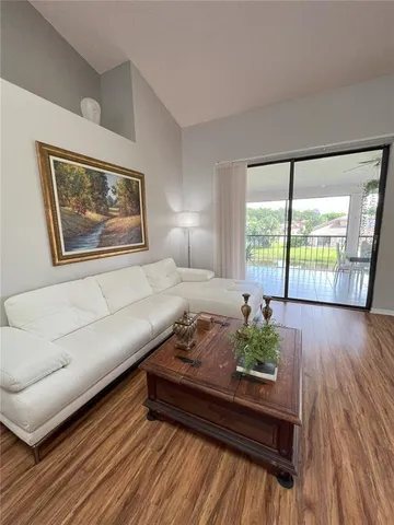 a living room with furniture and flat screen tv