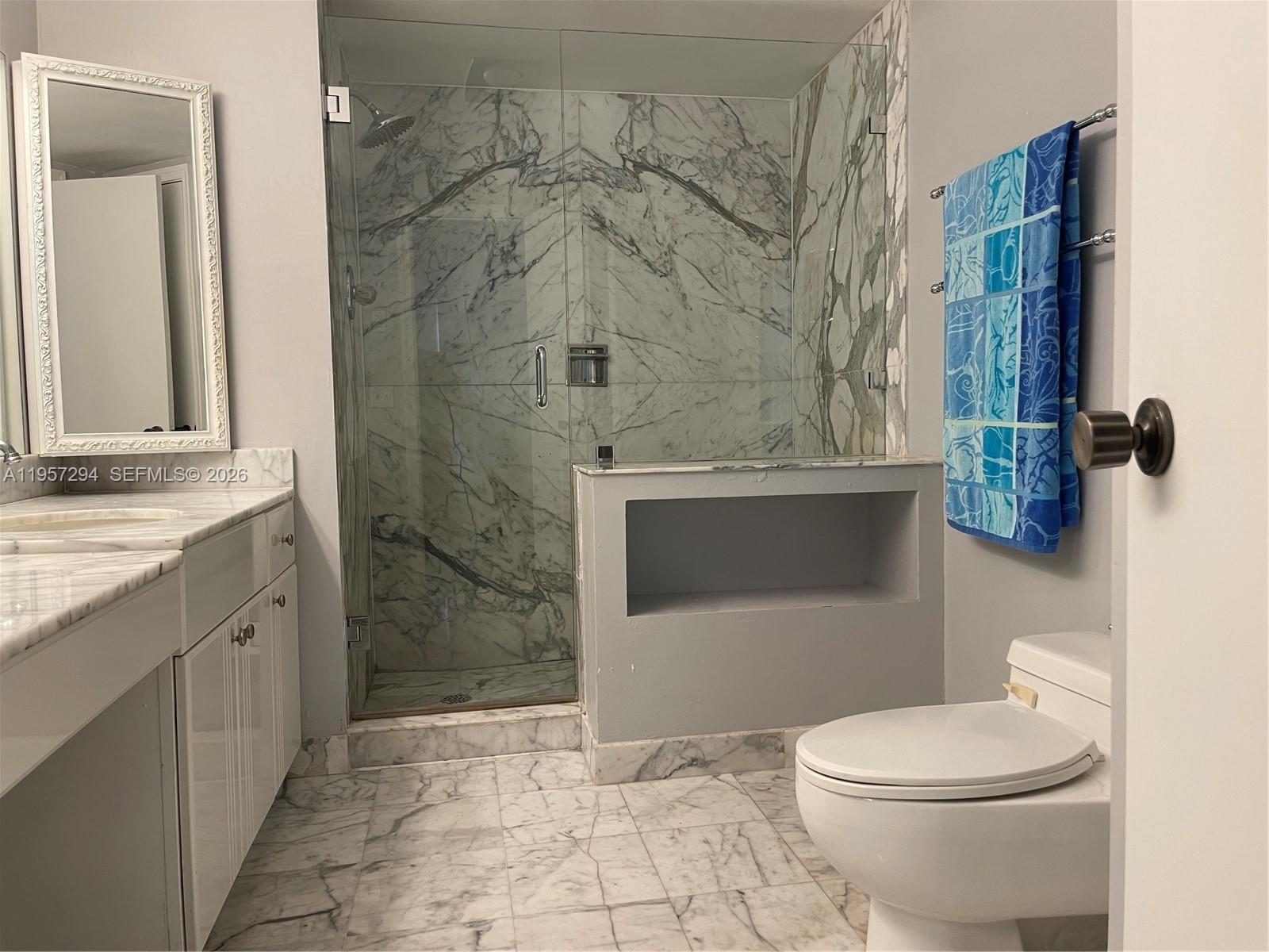 1370 South Ocean Boulevard, Unit 903 Pompano Beach, FL 33062 - Photo 13 of 30 a bathroom with a toilet and a shower