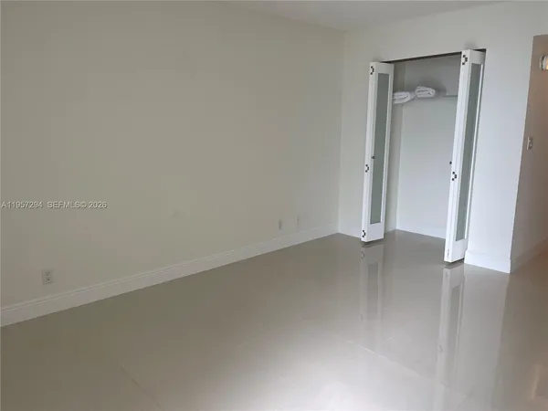 an empty room with a bathroom