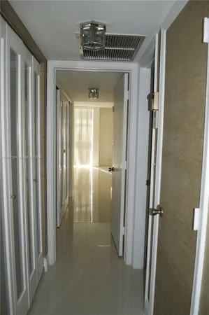 a view of a hallway with closet area