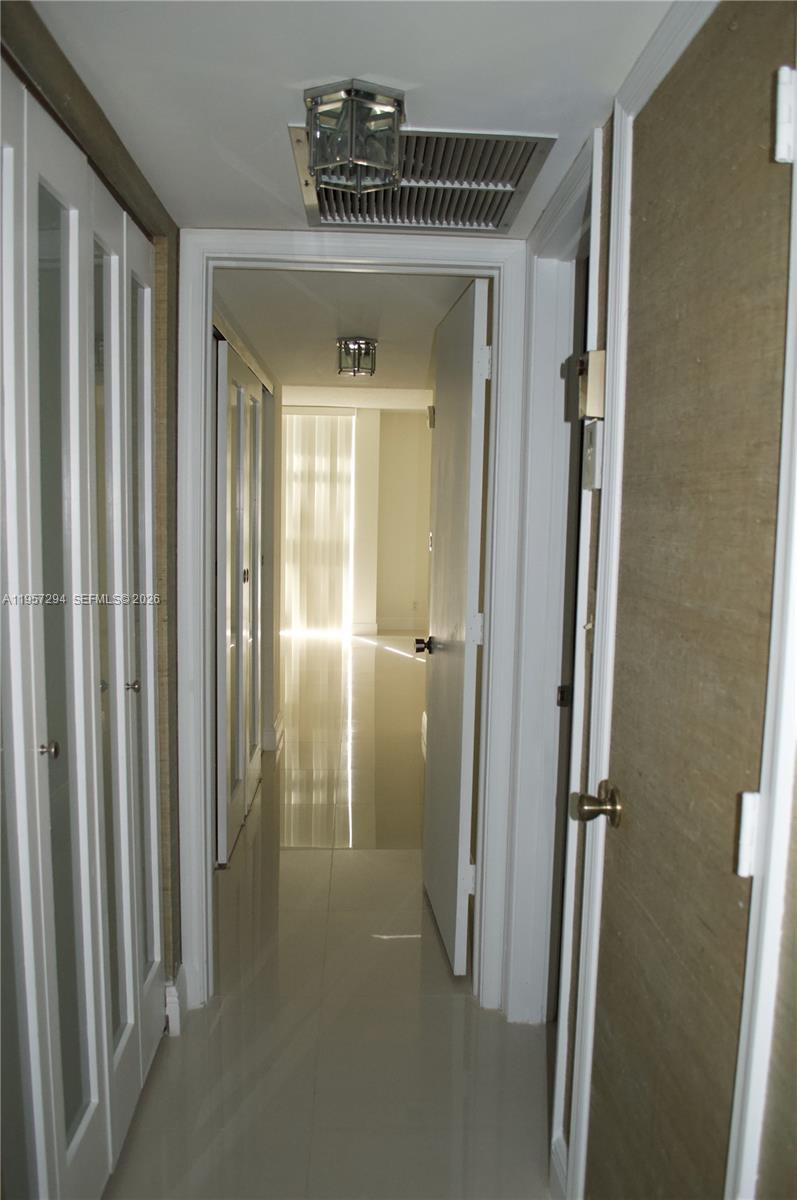 1370 South Ocean Boulevard, Unit 903 Pompano Beach, FL 33062 - Photo 16 of 30 a view of a hallway with closet area