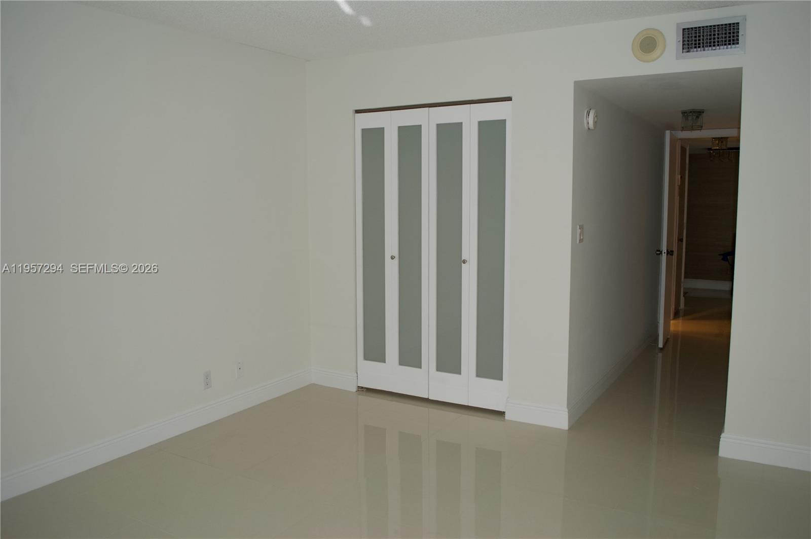 1370 South Ocean Boulevard, Unit 903 Pompano Beach, FL 33062 - Photo 18 of 30 wooden floor in an empty room