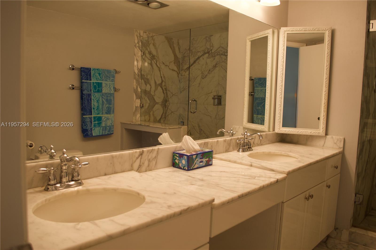 1370 South Ocean Boulevard, Unit 903 Pompano Beach, FL 33062 - Photo 20 of 30 a bathroom with a granite countertop sink and a mirror