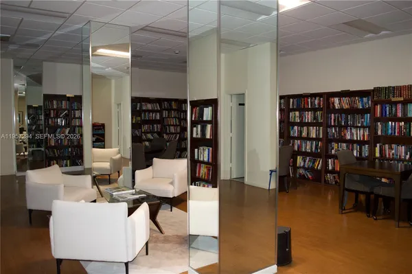a kitchen with a refrigerator sink and cabinets