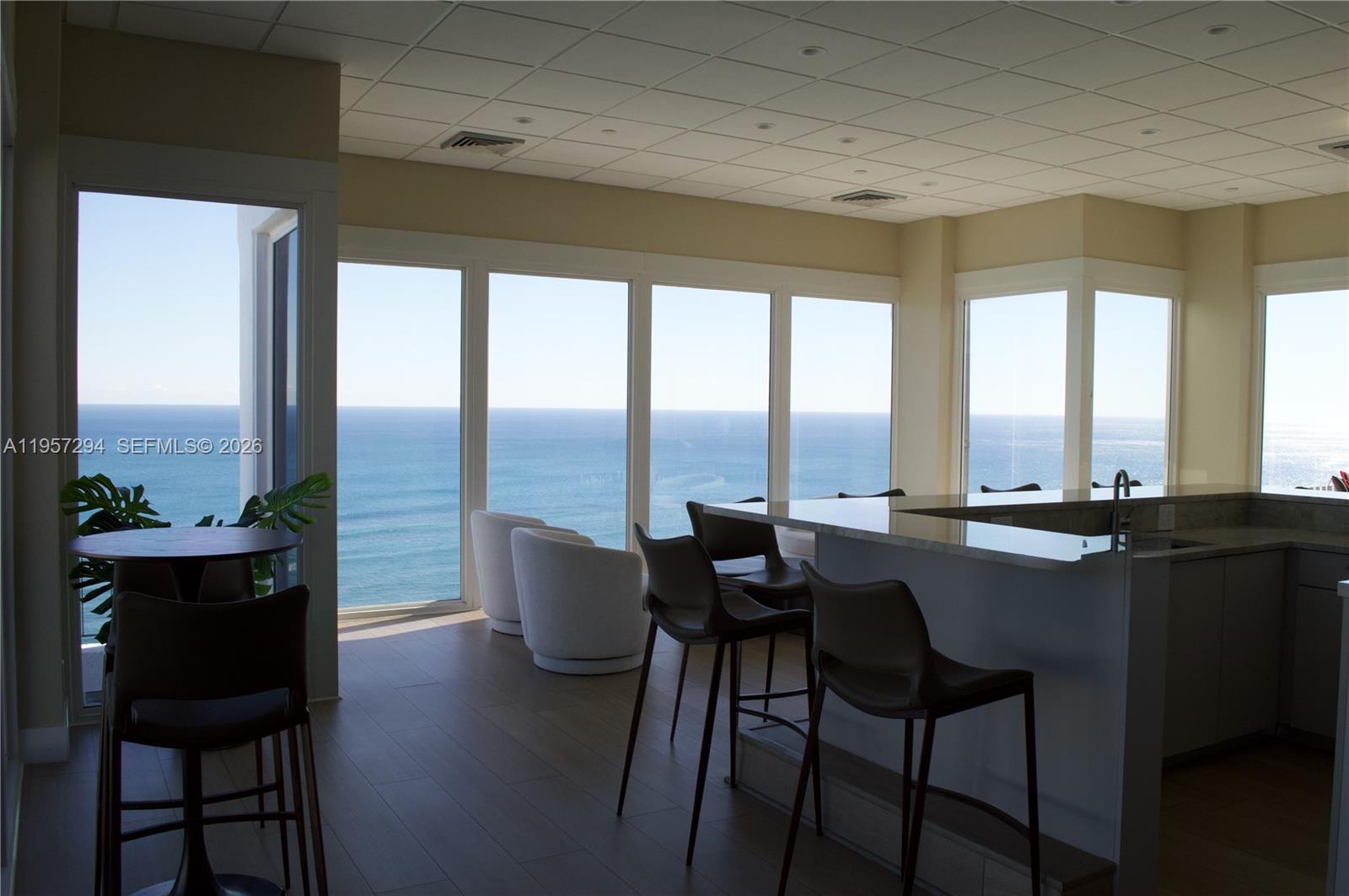 1370 South Ocean Boulevard, Unit 903 Pompano Beach, FL 33062 - Photo 32 of 34 a view of a dining room with furniture and window