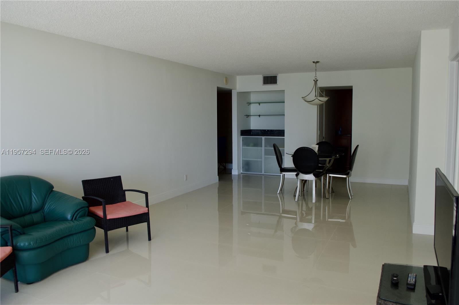 1370 South Ocean Boulevard, Unit 903 Pompano Beach, FL 33062 - Photo 5 of 30 a living room with furniture