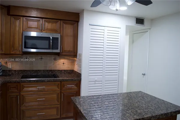 a kitchen with a stove and a microwave