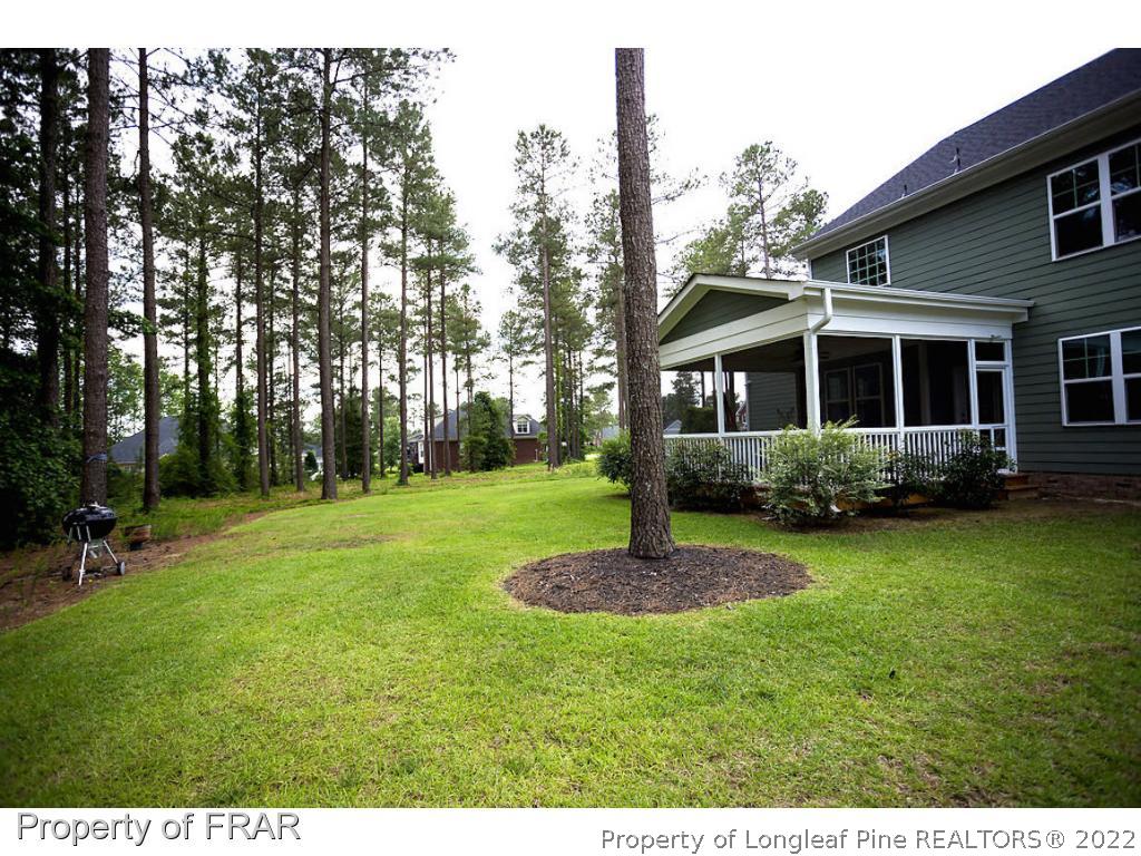 382 Falling Water Road Spring Lake, NC 28390 - Photo 3 of 36 a front view of a house with a garden