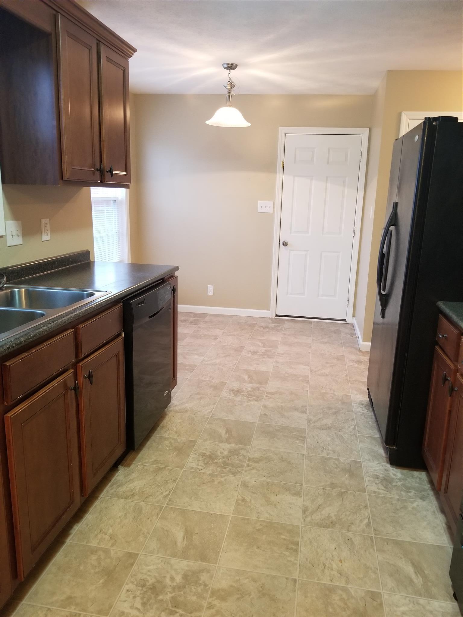 1537 Apache Way Clarksville, TN 37042 - Photo 10 of 19 a kitchen with stainless steel appliances a sink and a refrigerator