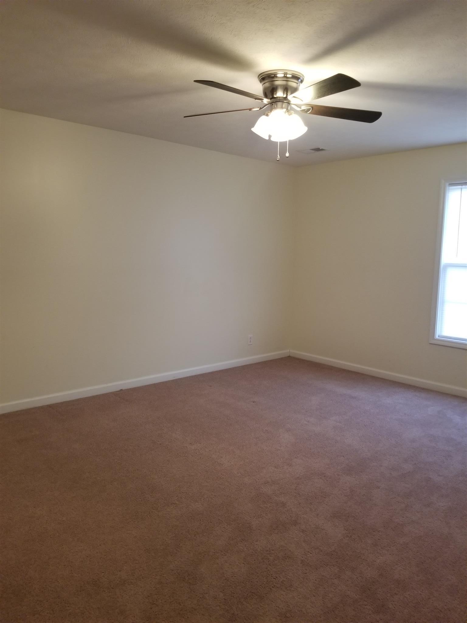 1537 Apache Way Clarksville, TN 37042 - Photo 12 of 19 a view of a livingroom with a chandelier fan