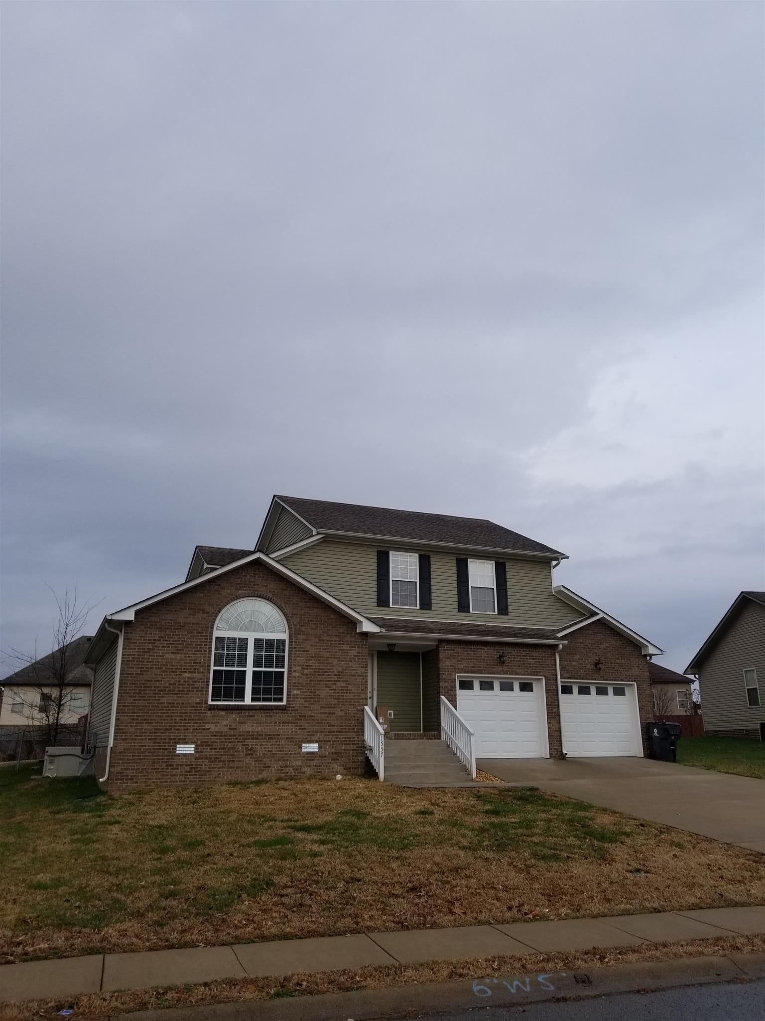 1537 Apache Way Clarksville, TN 37042 - Photo 18 of 19 a front view of a house with a yard