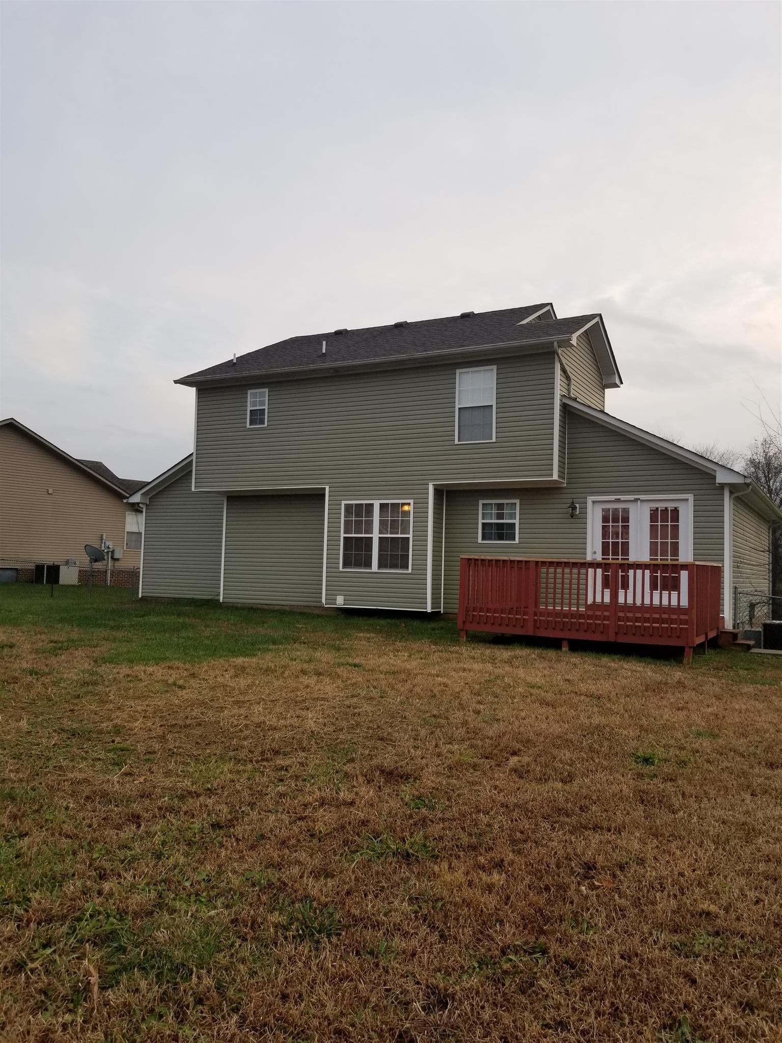 1537 Apache Way Clarksville, TN 37042 - Photo 2 of 19 a view of a yard in front of a house with large trees