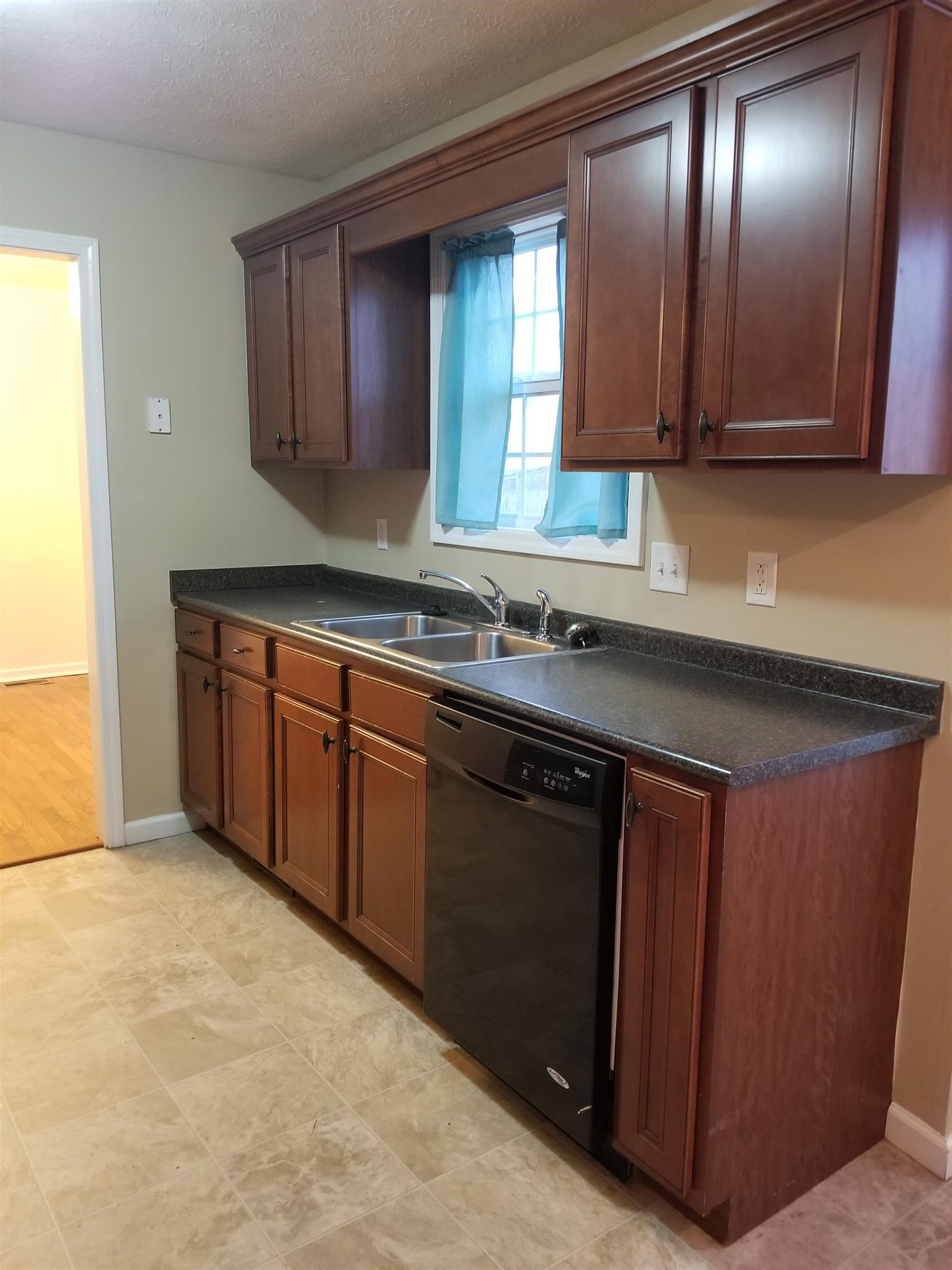1537 Apache Way Clarksville, TN 37042 - Photo 9 of 19 a kitchen with stainless steel appliances granite countertop cabinets and a sink