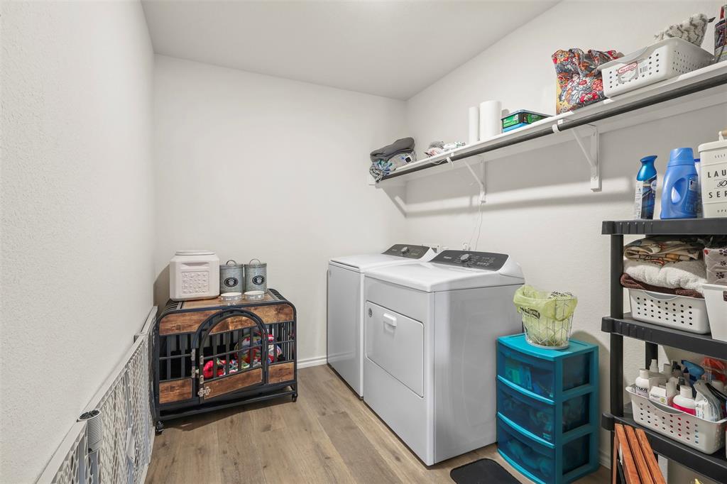 742 Buttercup Drive Pilot Point, TX 76258 - Photo 19 of 20 Laundry area featuring light wood-style floors and washing machine and clothes dryer