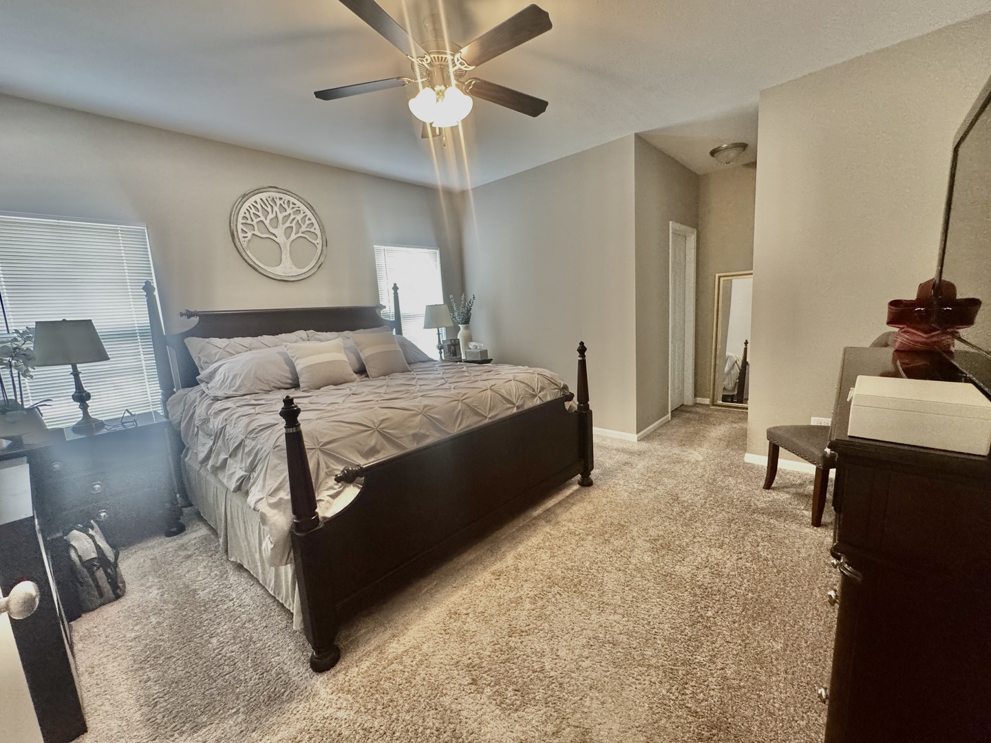 554 Stonebrook Drive Romeoville, IL 60446 - Photo 11 of 28 a bedroom with a bed and a chandelier
