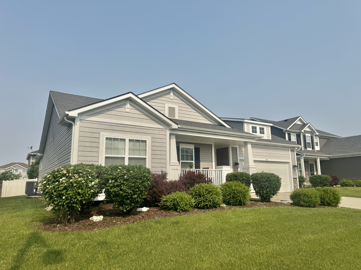 554 Stonebrook Drive Romeoville, IL 60446 - Photo 2 of 28 a front view of a house with a yard and garage
