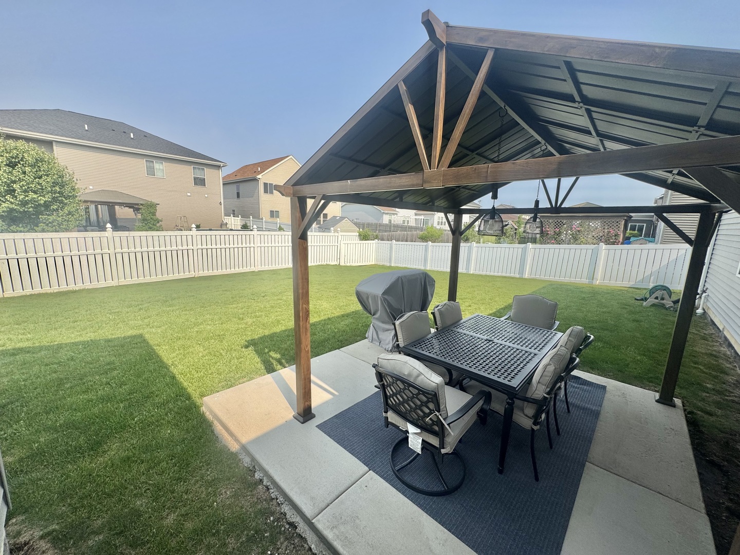 554 Stonebrook Drive Romeoville, IL 60446 - Photo 22 of 28 a patio with a table and chairs