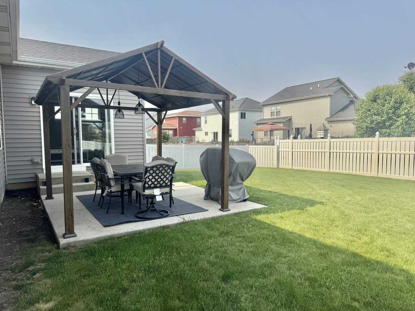 554 Stonebrook Drive Romeoville, IL 60446 - Photo 24 of 28 a view of a house with backyard and sitting area