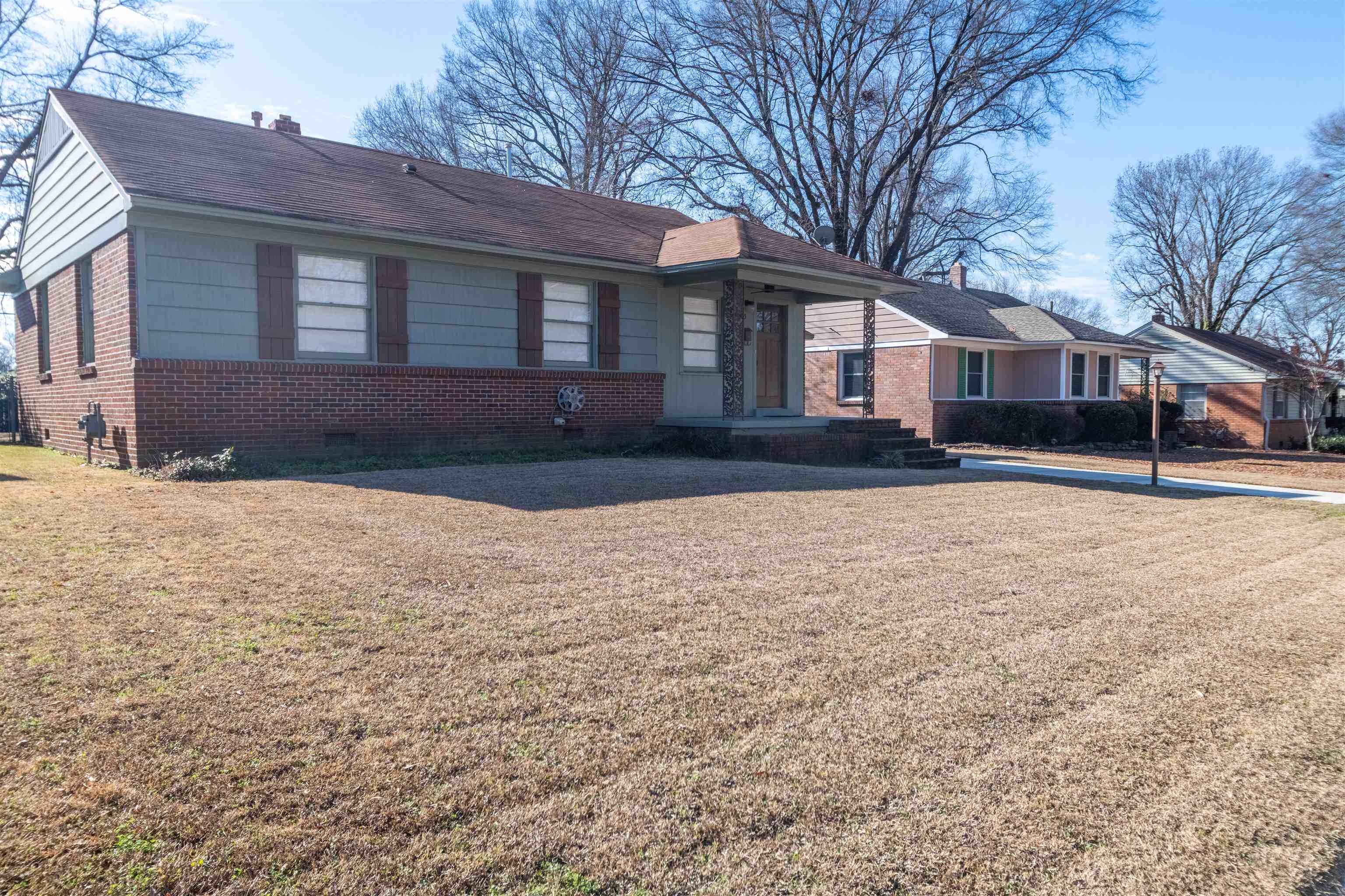 4915 Amboy Road Memphis, TN 38117 - Photo 2 of 17 a front view of a house with a yard covered in snow