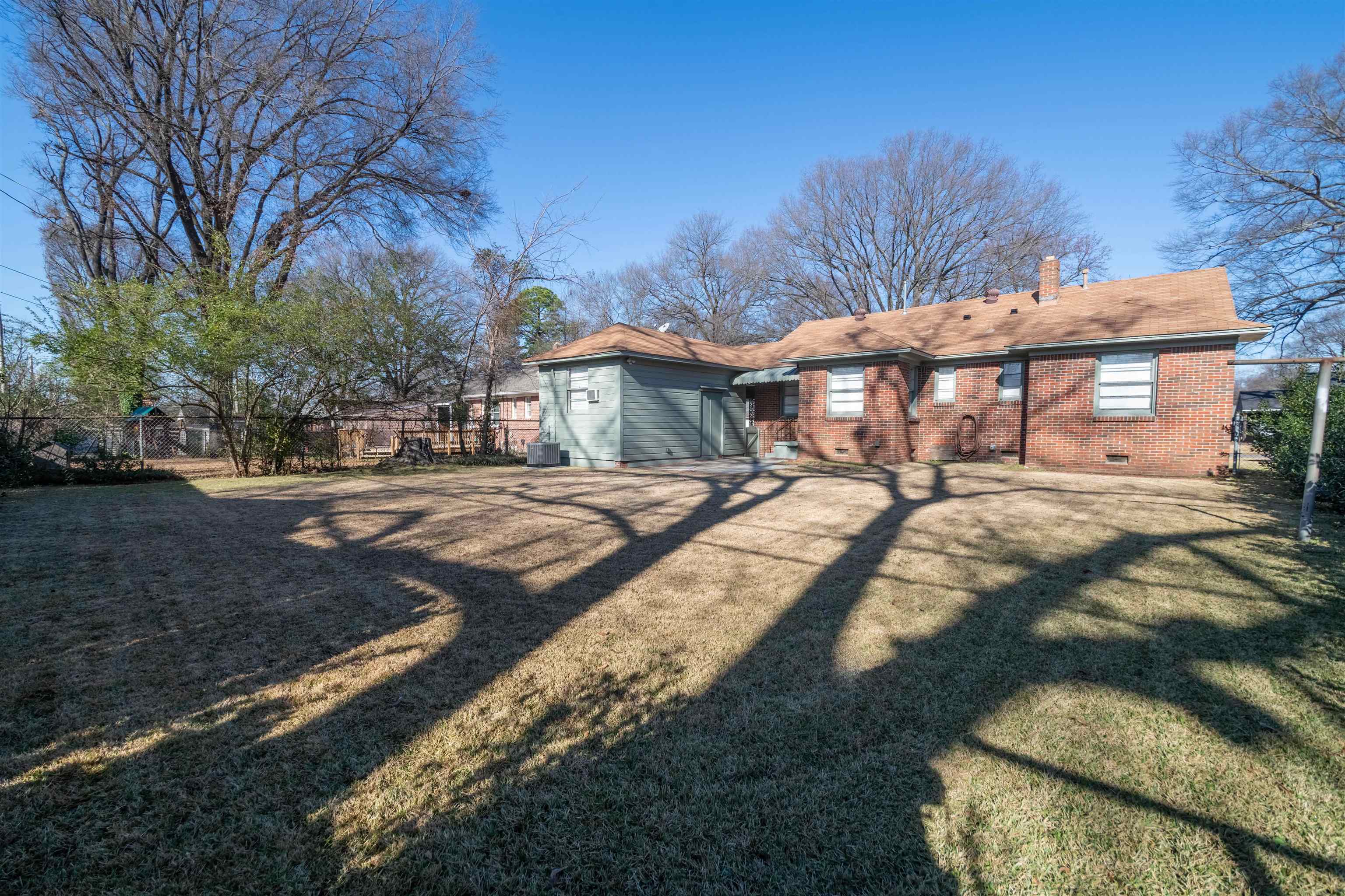 4915 Amboy Road Memphis, TN 38117 - Photo 5 of 17 a view of a yard with a house in the background