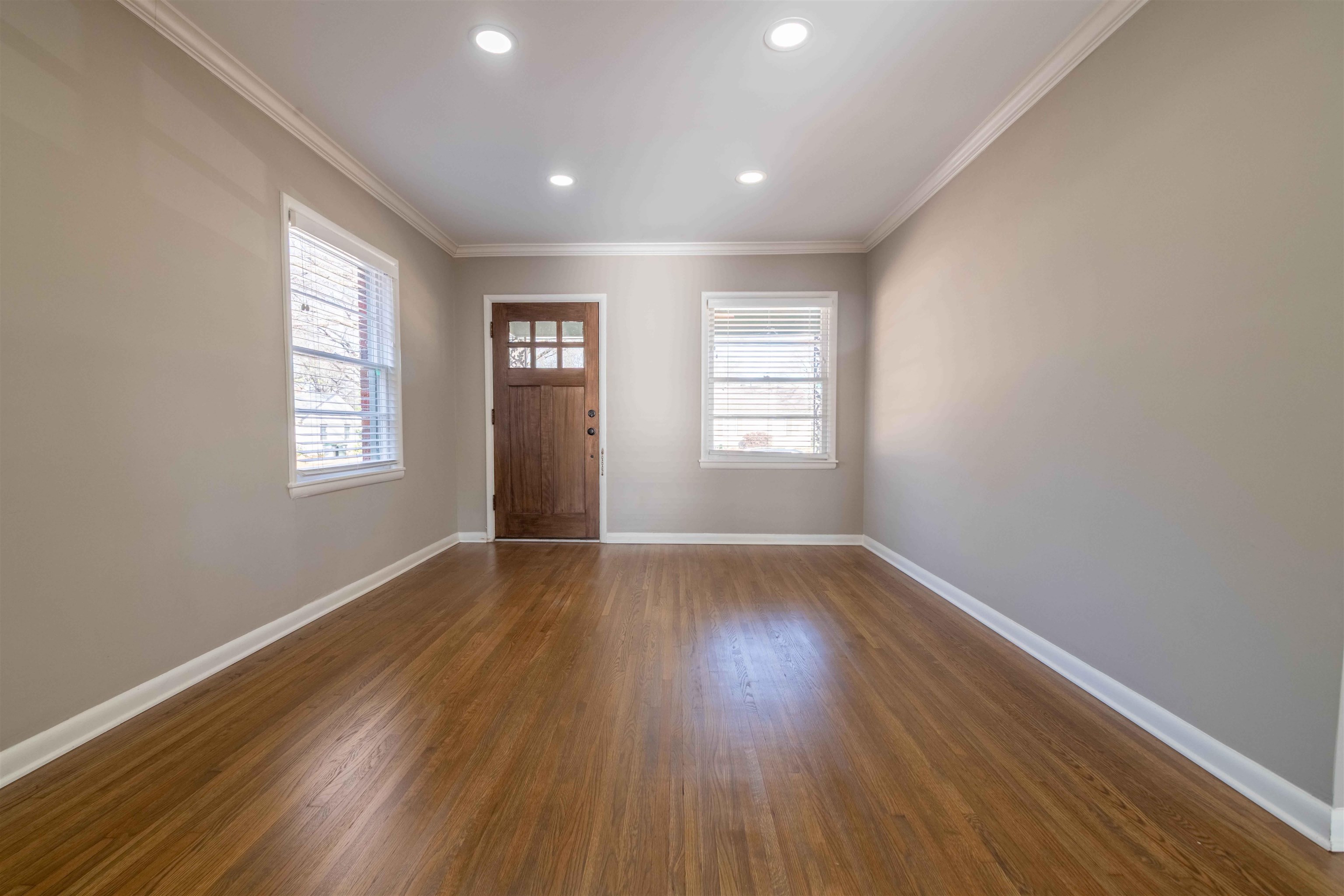 4915 Amboy Road Memphis, TN 38117 - Photo 7 of 17 an empty room with wooden floor and windows
