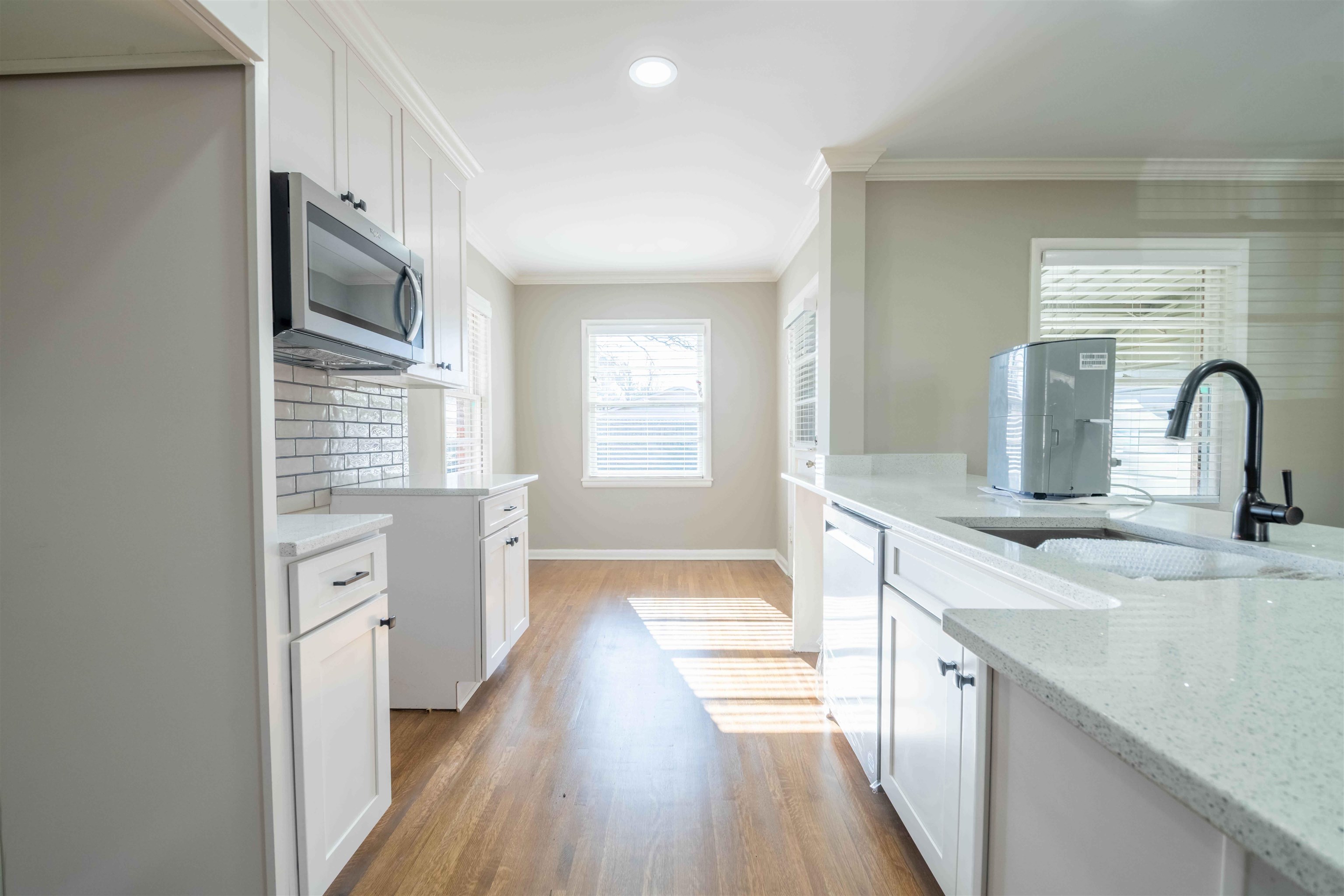4915 Amboy Road Memphis, TN 38117 - Photo 9 of 17 a kitchen with a refrigerator microwave and sink