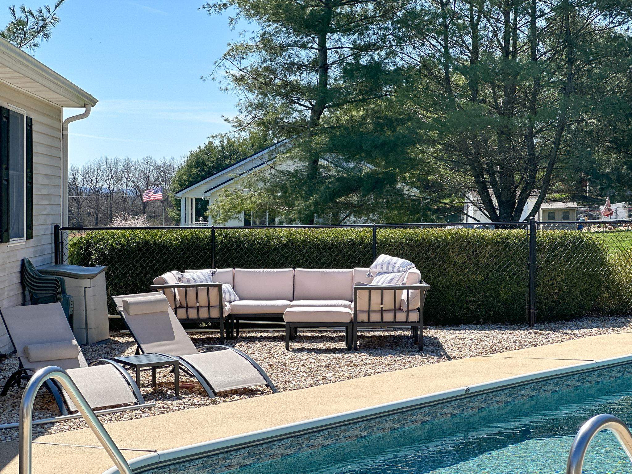 164 Spring Meadows Staunton, VA 24401 - Photo 12 of 37 a view of a patio with couches table and chairs and potted plants