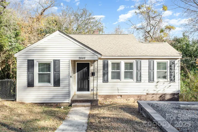a house with trees in the background