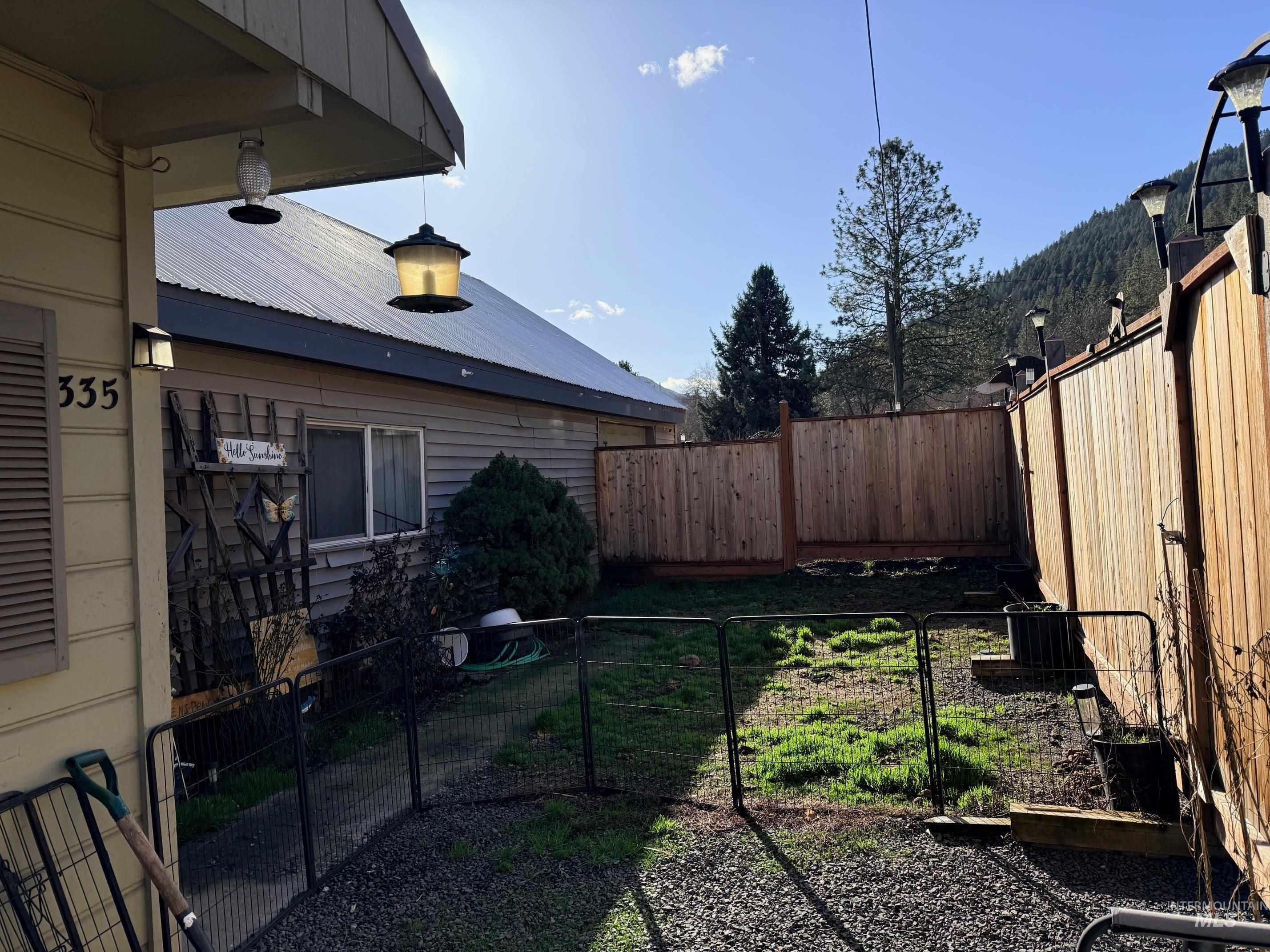 335 Pine Street Peck, ID 83545 - Photo 3 of 36 Fenced backyard with a gate