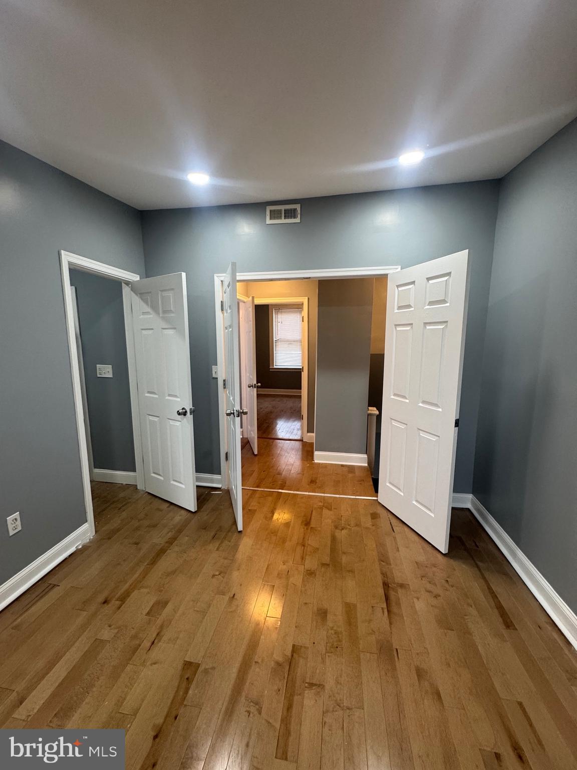 3221 Lyndale Avenue Baltimore, MD 21213 - Photo 16 of 21 a view of empty room with wooden floor