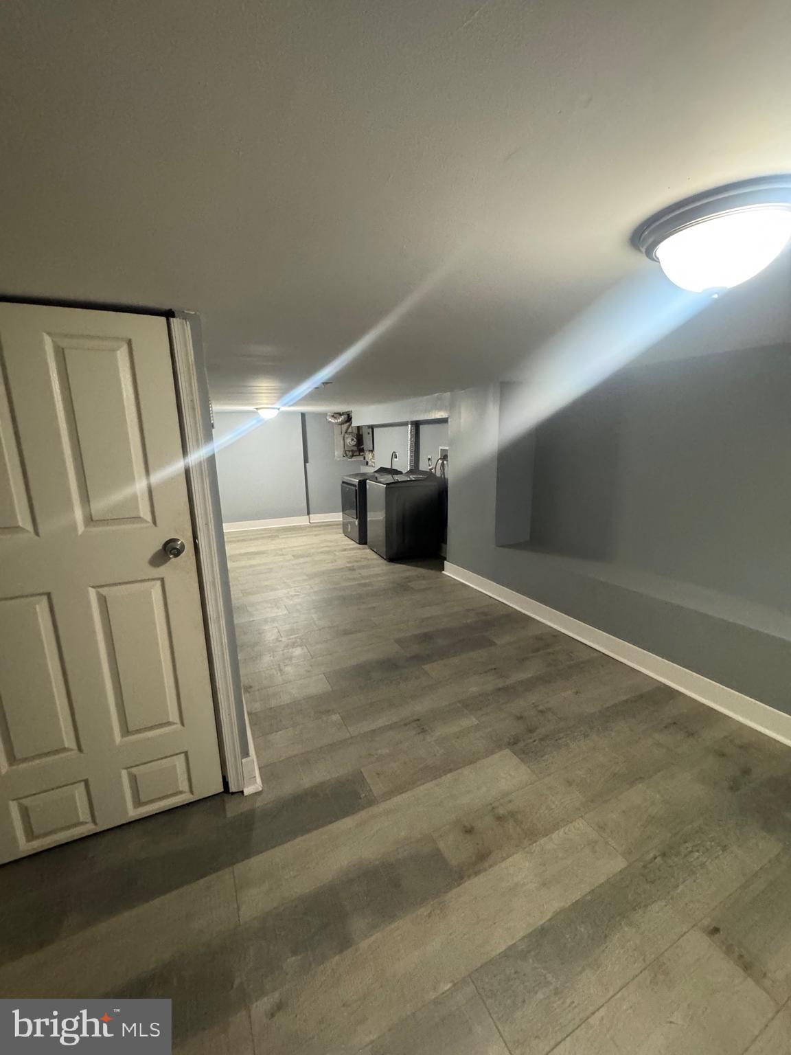 3221 Lyndale Avenue Baltimore, MD 21213 - Photo 20 of 21 a view of empty room with wooden floor