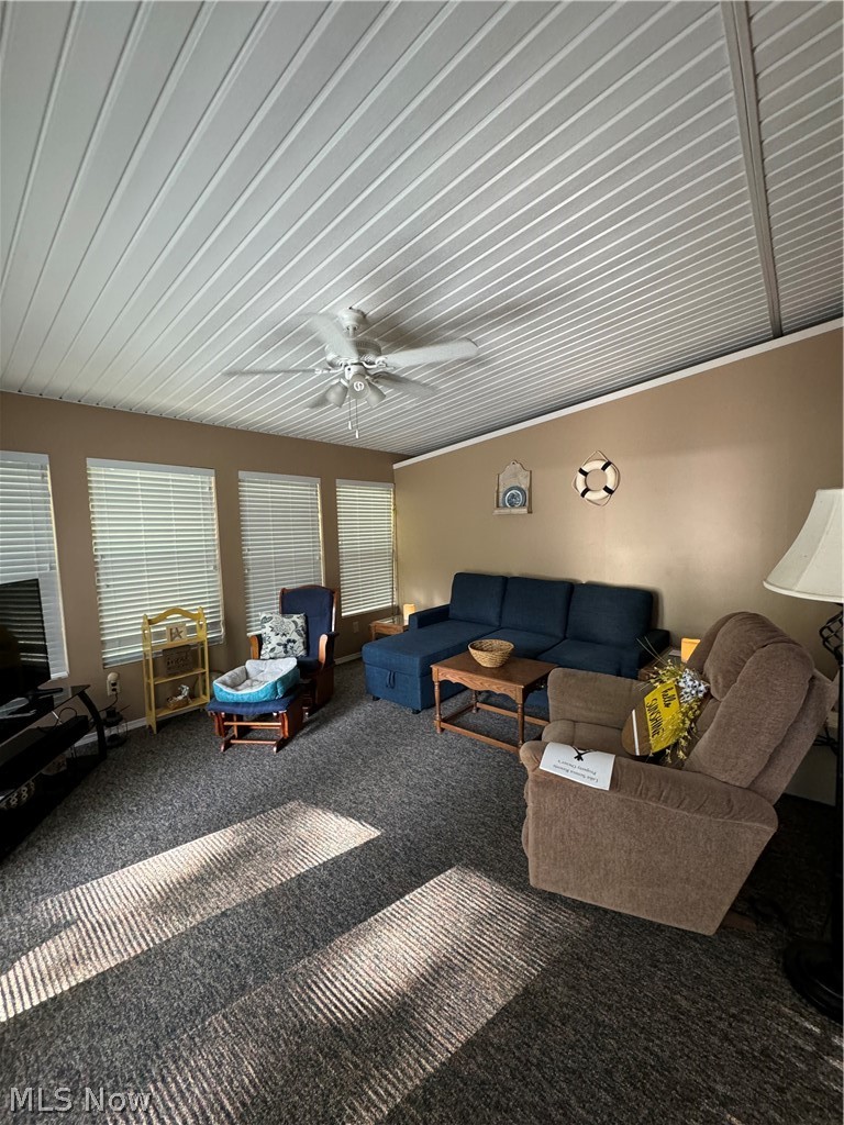 17875 Lashley Road, Unit 403 Senecaville, OH 43780 - Photo 7 of 22 Carpeted living room with ceiling fan