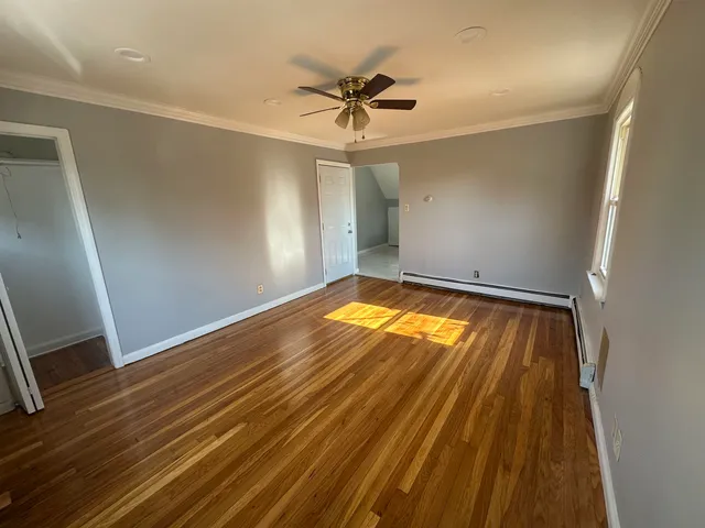 a view of room with ceiling fan