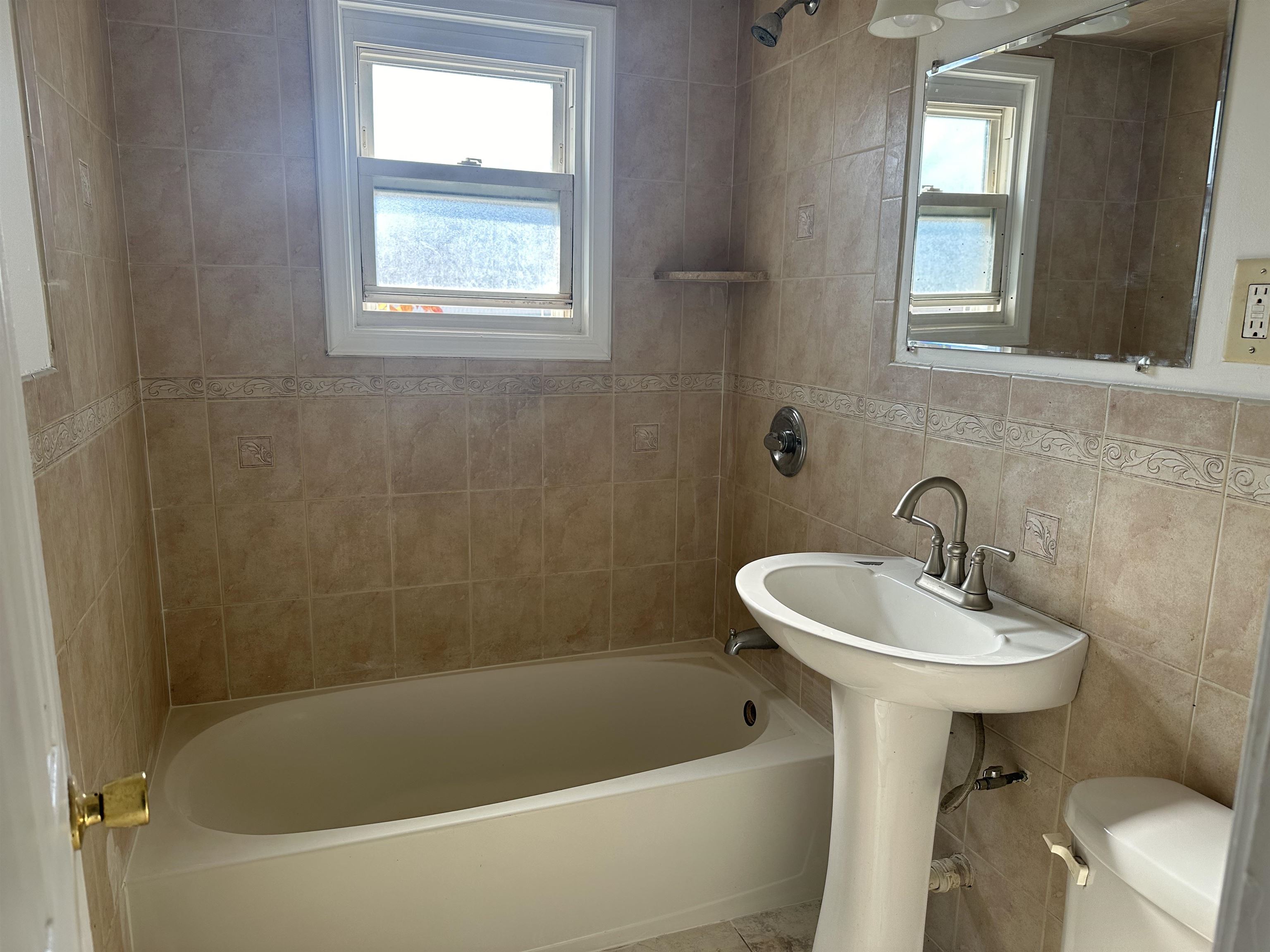 6 Kelly Parkway, Unit 2 Bayonne, NJ 07002 - Photo 4 of 9 a white bath tub sitting next to a white sink