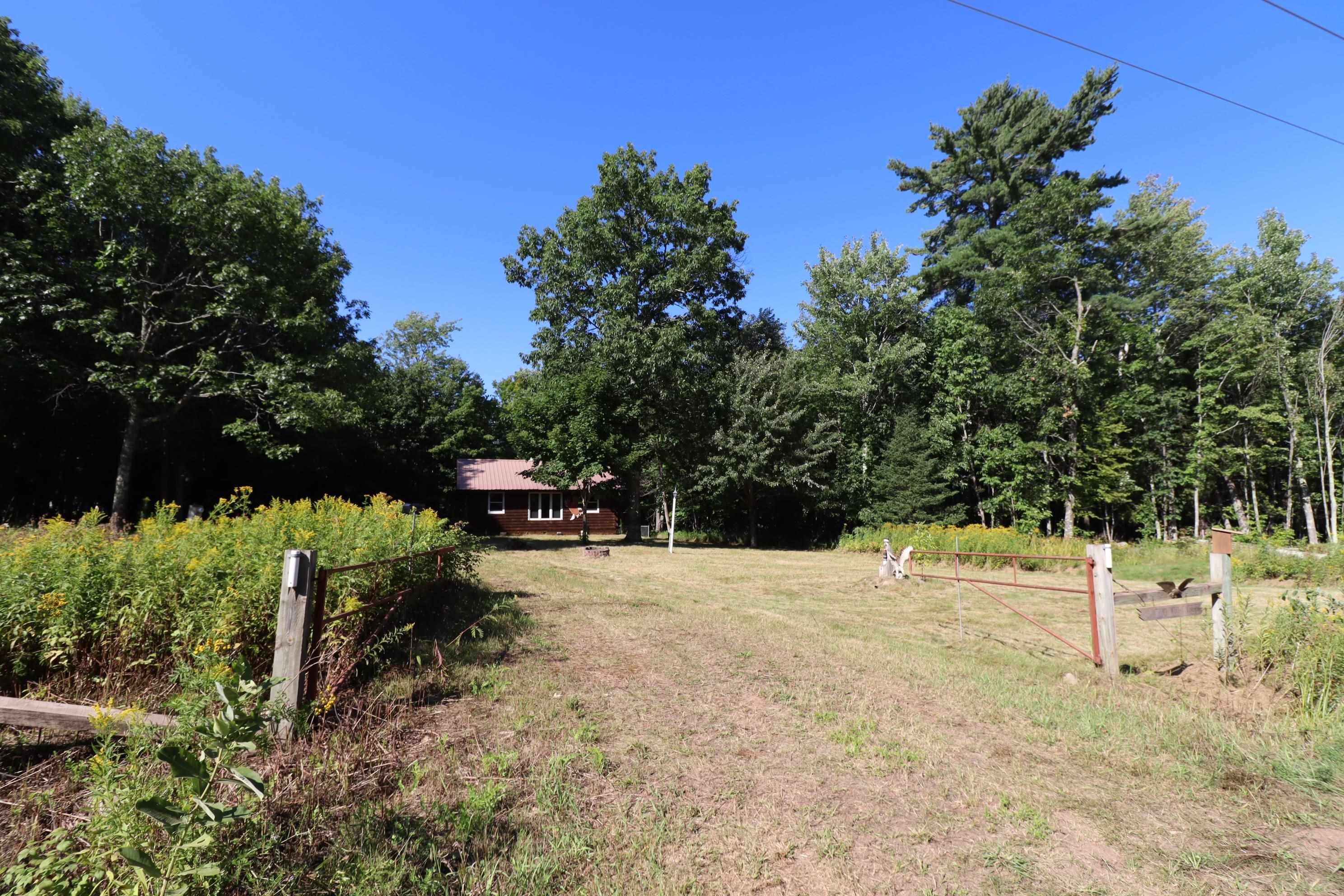 13240 Touve Road Port Wing, WI 54865 - Photo 4 of 29 View of yard with a wooded view