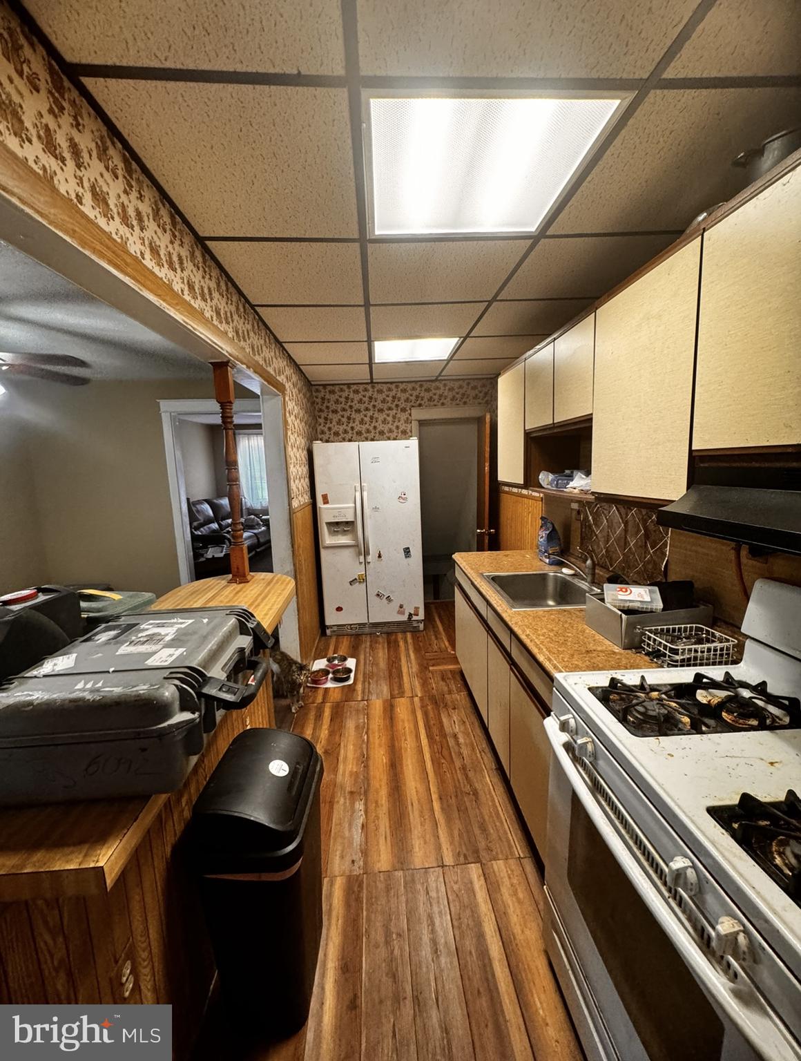 7033 Radbourne Road Upper Darby, PA 19082 - Photo 4 of 9 a kitchen with a stove and a sink